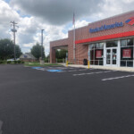 Crisp, ADA-compliant parking lot line striping completed by Davis Line Striping at Bank of America in Pottstown, Pennsylvania. Fresh line striping in a newly paved parking lot at Bank of America in Pottstown, PA